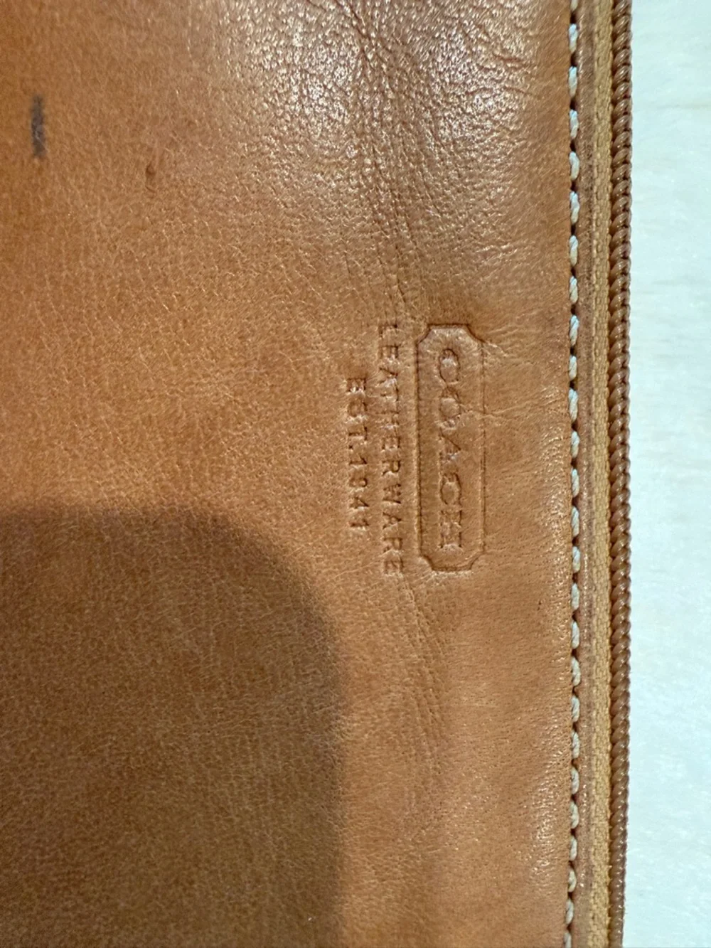 Coach Tan Leather Wristlet with Black Strap , It's staine in some places